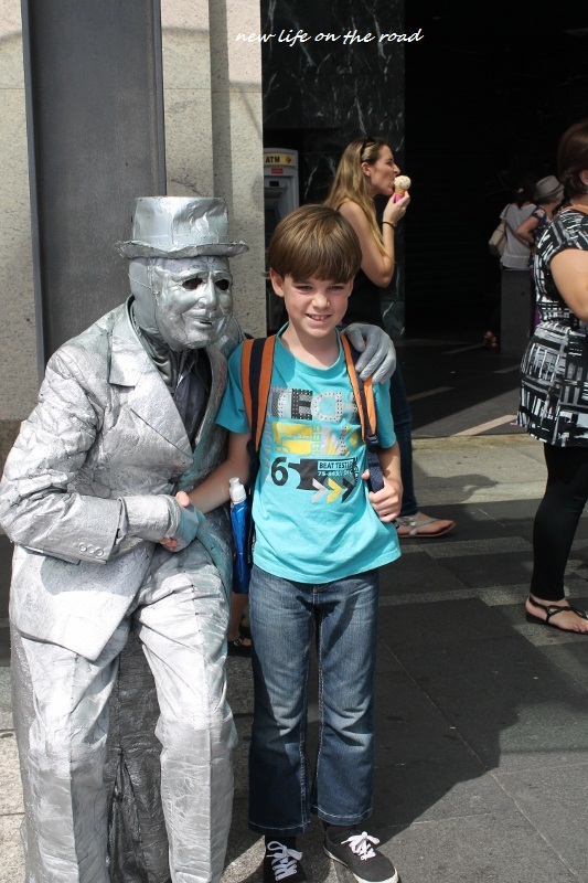 Cameron with a Street Statue