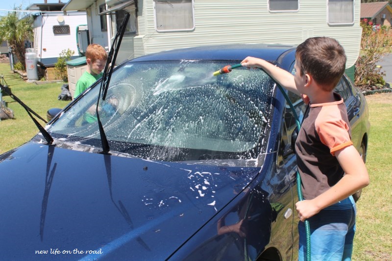 Kyle and Cameron washing their brothers car