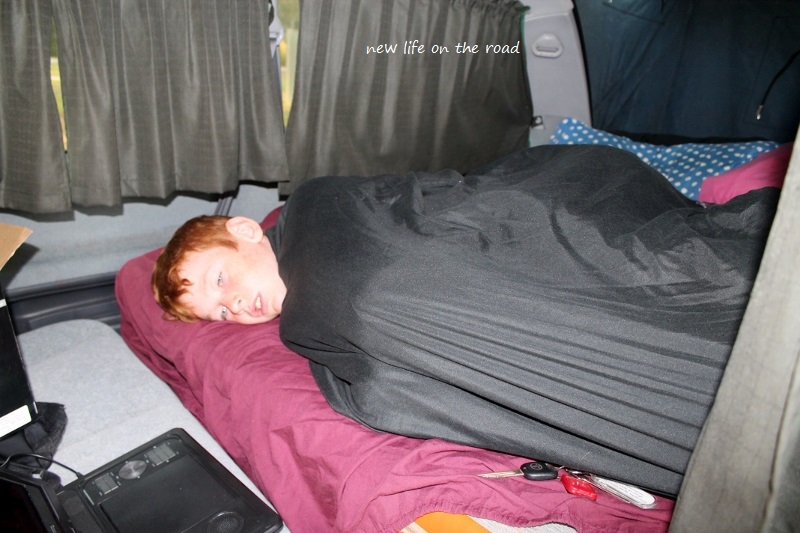Kyle sleeping in the Camper van